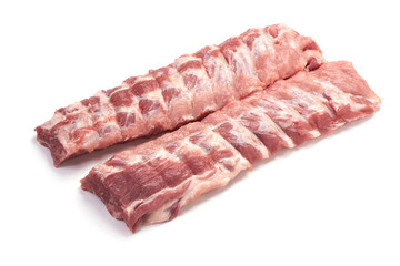 Fresh raw pork loin with ribs, close-up, isolated on white background.