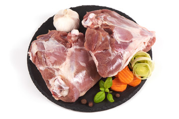 Raw turkey meat on stone plate, isolated on white background.