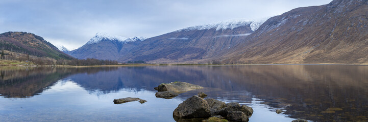 landscape view of scotland and loch etive with rocks in the foreground