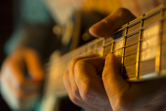 performance with a guitar, close up