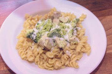 Macaroni with broccoli and chicken breast