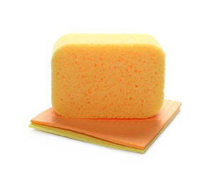 Yellow sponge and clean cloths isolated on white background