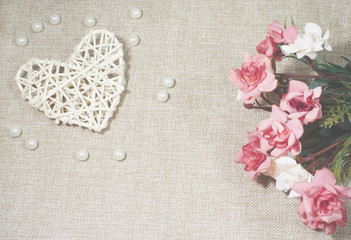 Heart and roses on the jute background, Saint Valentine's Day concept