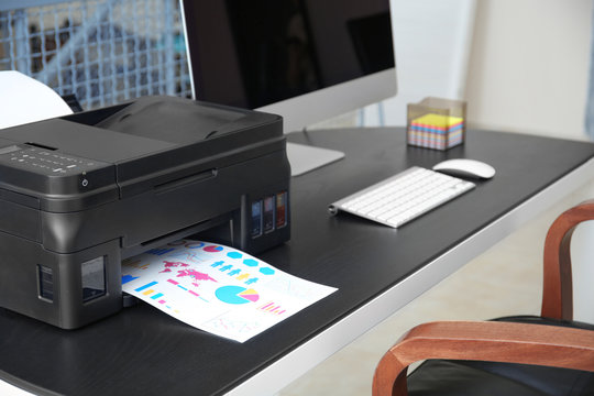 Printing document with diagrams in office, closeup