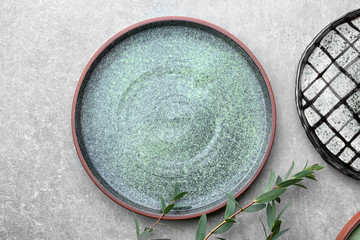 Ceramic plate on grey background