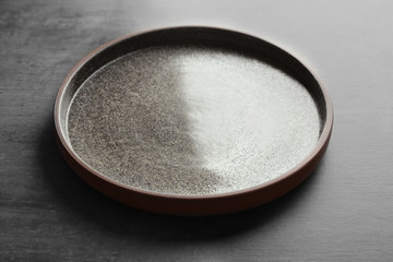 Obraz na płótnie Canvas Ceramic plate on grey background