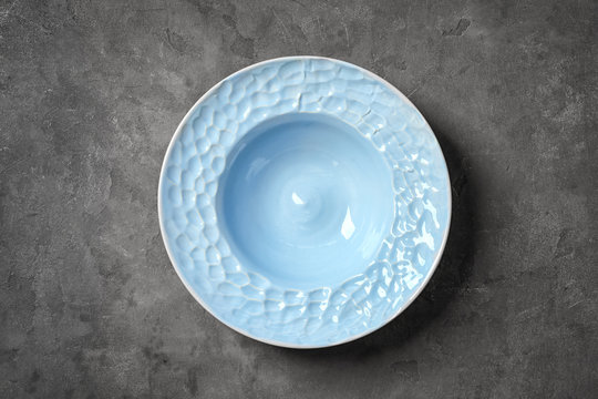 Ornate ceramic plate on grey background