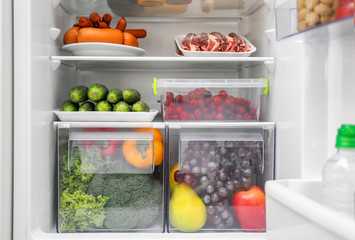 Different products on refrigerator shelves