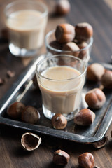 Cream liqeuer with hazelnuts, homemade, selective focus, toned image