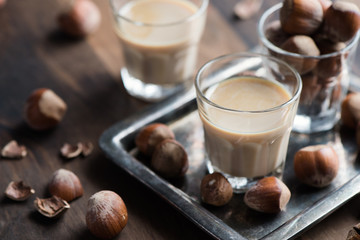 Cream liqueur with hazelnuts, homemade, selective focus, toned image