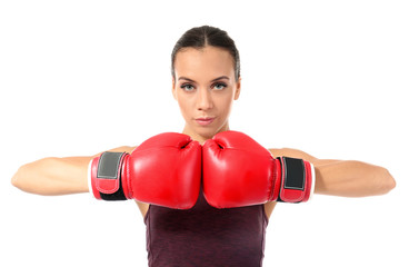 Strong woman in boxing gloves on white background