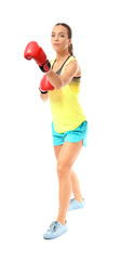 Strong woman in boxing gloves on white background