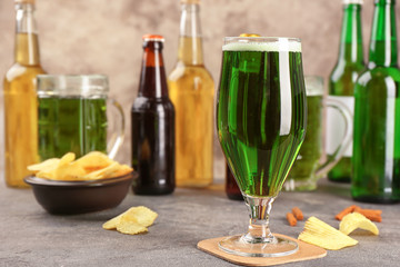 Glass of green beer on table. Saint Patrick's day celebration