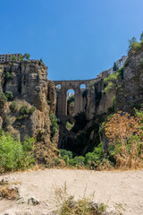 A gorge in the city of Ronda Spain, Europe on a hot summer day © SkandaRamana