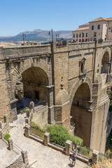A gorge in the city of Ronda Spain, Europe on a hot summer day © SkandaRamana