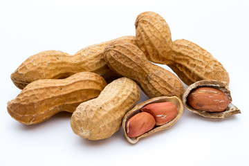 Dried peanuts on the white background.