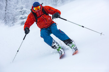 A skier is in the deep snow.