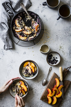 Super seedy vegan baked oatmeal with peaches and huckleberries