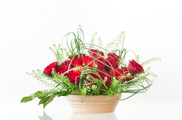 Decorative Bouquet of Red Roses in a Ceramic Container
