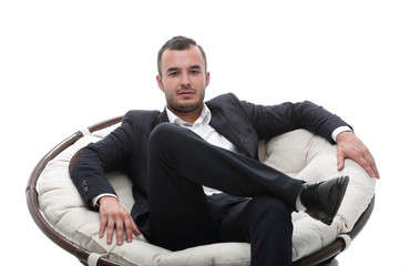 young businessman sitting in a comfortable chair