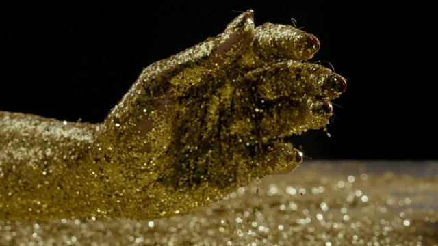 Golden glitter moving , Red Epic slow motion conceptual clip