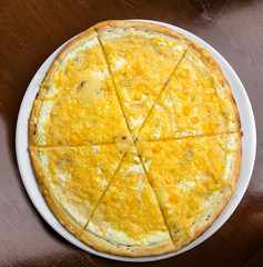 Pizza on a table on a round plate
