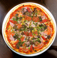 Pizza on a table on a round plate