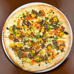 Pizza on a table on a round plate