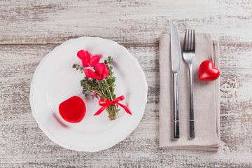 Rustic table setting with thyme and cyclamen flowers