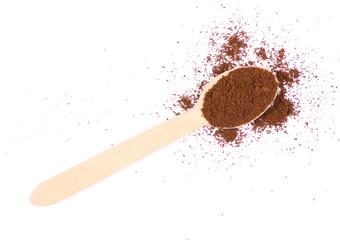 Coffee ground wooden spoon on a white background