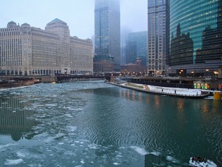 Foggy morning in Chicago with view of frozen Chicago River running through the Loop