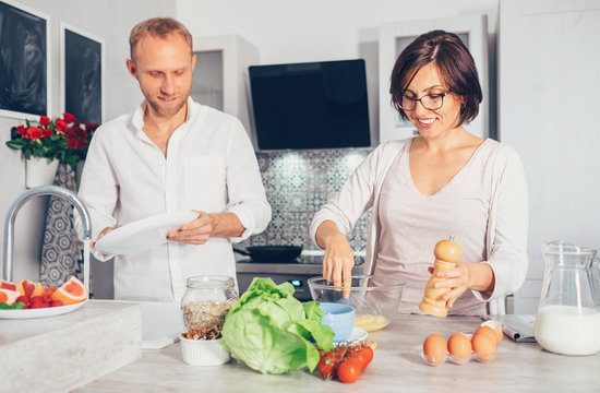 Family moments concept image - married prepare meal together.