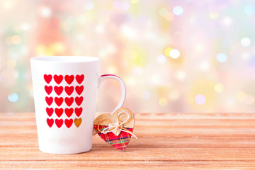 Mug with hearts on the table