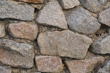 Texture. Masonry. Fragment of the ancient wall.Horizontal