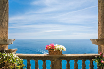 beautiful sea view in the town of Positano from antique terrace with flowers, Amalfi coast, Italy