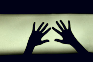 Abstract Background. Black Shadows Of A Big Hands On The Wall. Silhouette Of A Hands On The Wall. Nightmares in Children. Scary Dreams.

