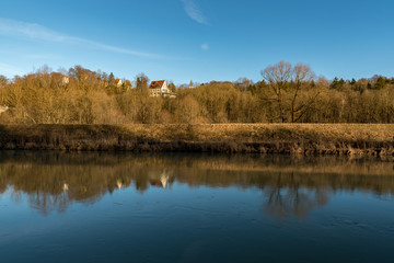 View to the Burg Grünwald with great reflections on the Isar