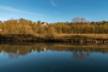 Fototapeta na wymiar View to the Burg Grünwald with great reflections on the Isar