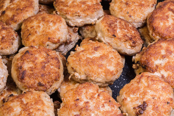 lots of fried chops in a frying pan, homemade Russian cuisine, food background