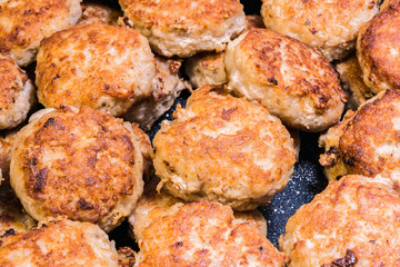 lots of fried chops in a frying pan, homemade Russian cuisine, food background