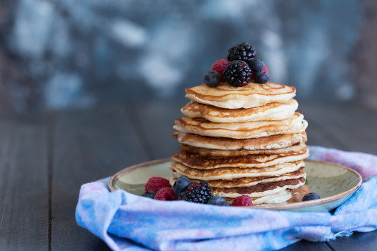 Pancakes with berries and honey