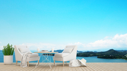 Fototapeta premium restaurant or lounge in hotel or condominium - living area on balcony and sea view - artwork for holiday time - Blur background - 3D Rendering