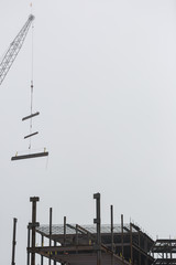Steel construction with a working crane