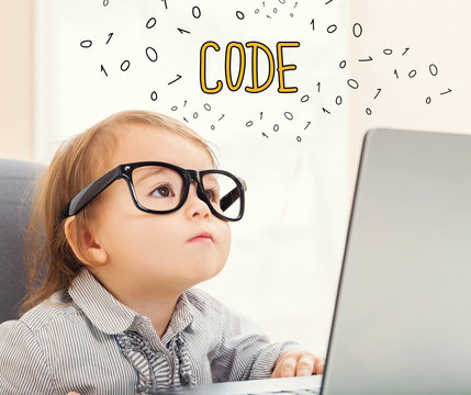 Code text with toddler girl using her laptop