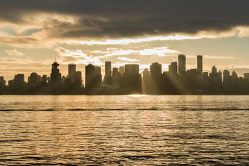 Fototapeta na wymiar Downtown Vancouver British Columbia Canada. Sunset after the rain. Cloudy city view,