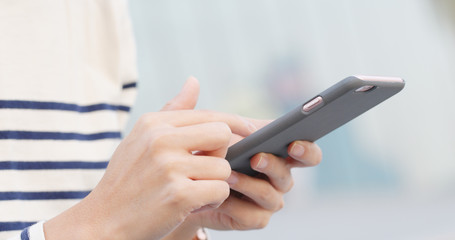 Woman use of cellphone at outdoor