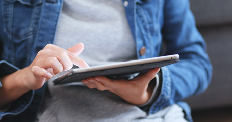 Close up of woman using tablet computer