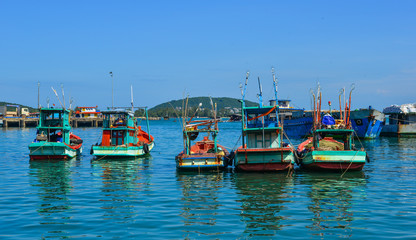 Fototapeta na wymiar Boats docking at pier in Southern Vietnam
