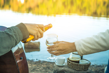 Woman sitting drinking beer relaxing on holiday with beautiful nature.