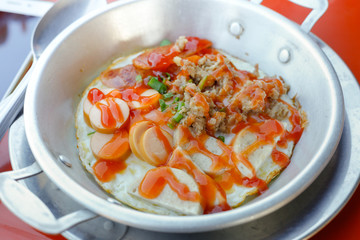 fried egg in pan.